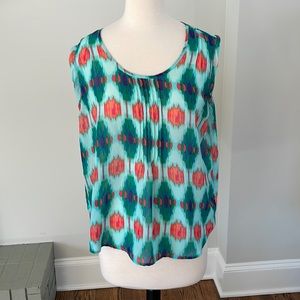 Lightweight sheer sleeveless top.